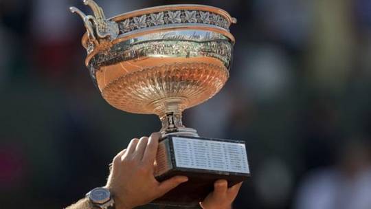 Jun 7, 2015; Paris, France; Stan Wawrinka (SUI) poses with the trophy after recording match point in his match against Novak Djokovic (SRB) on day 15 of the 2015 French Open at Roland Garros. Mandatory Credit: Susan Mullane-USA TODAY Sports